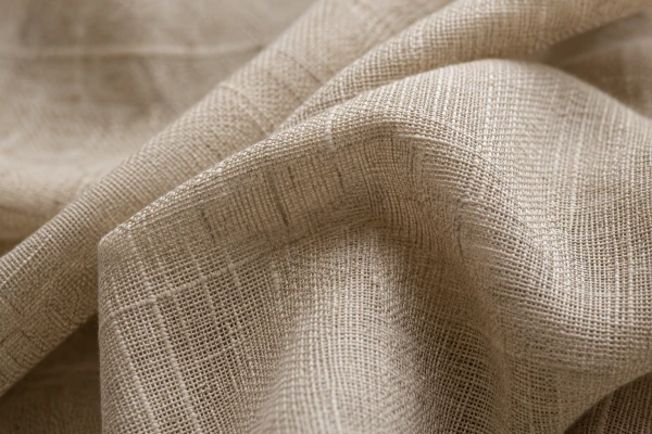 Close-up texture of natural linen fabric showing woven flax fibers and crisp surface