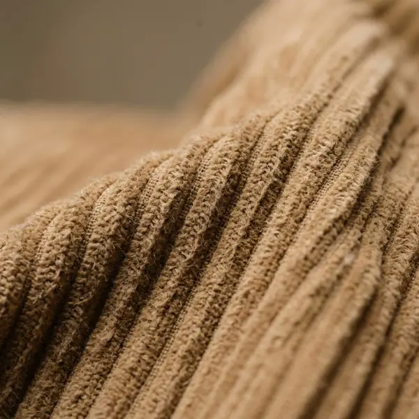 Close-up tekstur kain corduroy dengan garis-garis wale yang terlihat jelas Close-up tekstur kain corduroy dengan garis-garis wale yang terlihat jelas