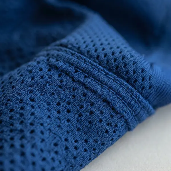 Close-up of polyester mesh fabric used in football jersey construction Close-up of polyester mesh fabric used in football jersey construction