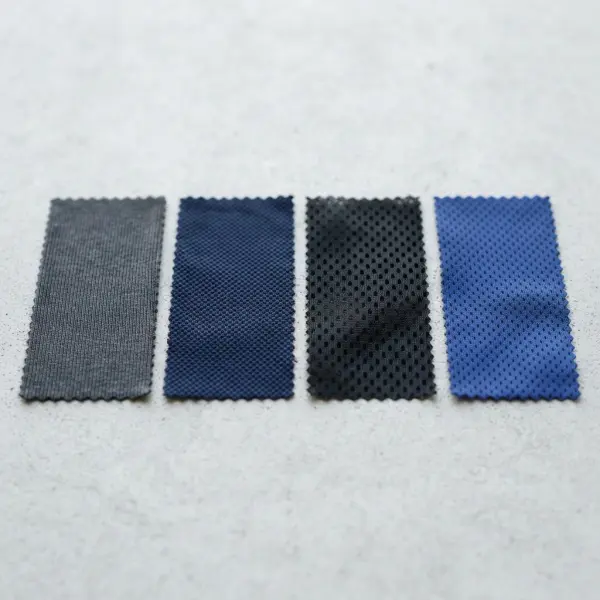 Close-up comparison of interlock, pique, mesh, and bird-eye sportswear fabrics
