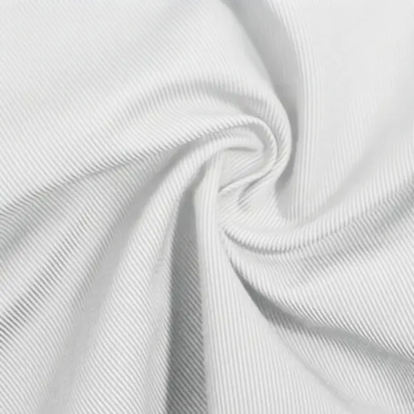 Tekstur diagonal khas kain katun twill berwarna krem Tekstur diagonal khas kain katun twill berwarna krem