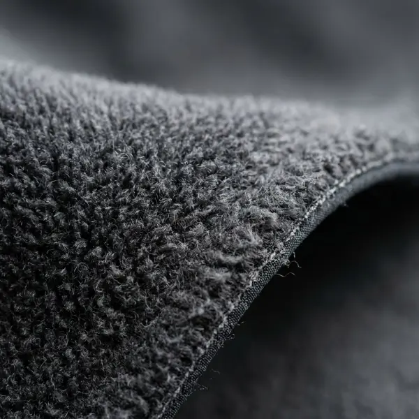 Tekstur bagian dalam bahan softshell dengan lapisan fleece lembut Tekstur bagian dalam bahan softshell dengan lapisan fleece lembut
