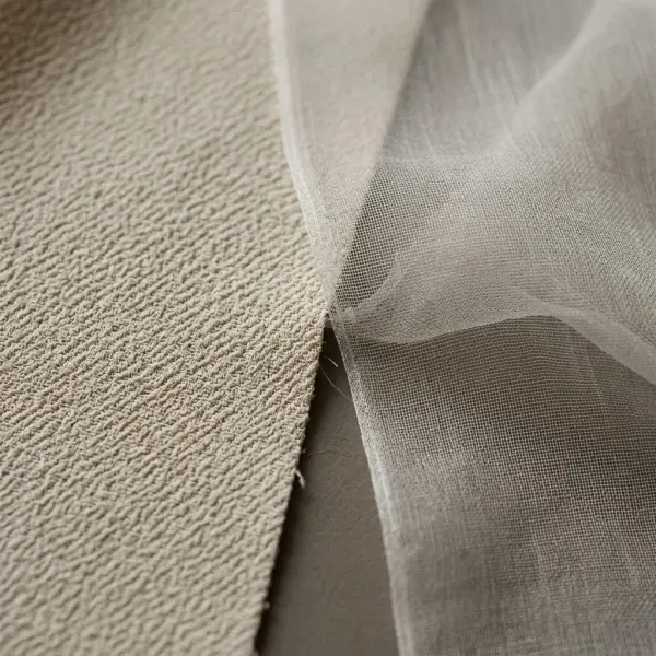 Close-up comparison showing the textured surface of crepe and the fine sheer structure of chiffon
