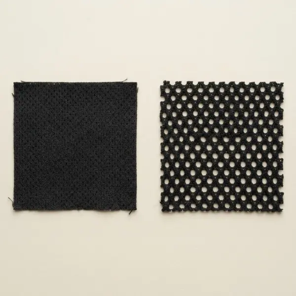 Side-by-side macro comparison of fine knitted mesh and wide-open knitted mesh textile structures Side-by-side macro comparison of fine knitted mesh and wide-open knitted mesh textile structures