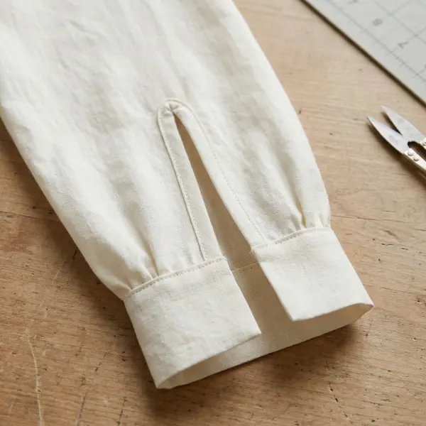Lightweight blouse sleeve showing a continuous bound placket and a clean finished opening above the cuff Lightweight blouse sleeve showing a continuous bound placket and a clean finished opening above the cuff